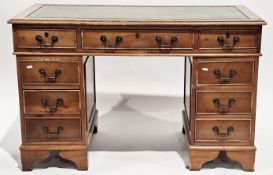 V Yew wood twin-pedestal writing desk in the George III manner, the rectangular top inset with a