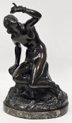 Bronze figure, female nude, seated on a rocky outcrop with a snake entwined around her hand, on an