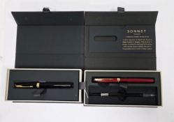 V Two boxed Parker Sonnet converted filled fountain pens, one with black lacquered case and the