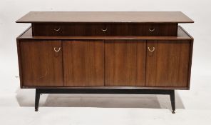 Mid-century G-Plan Librenza tola wood sideboard, comprising three drawers over two folding