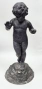 Lead garden water fountain in the 19th-century style formed as a cherub or putto standing on a rocky