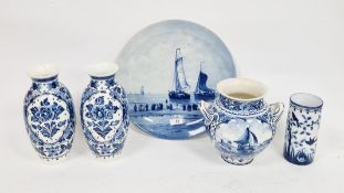 20th century Dutch Delft circular wall plaque, painted with fishing boats, signed H.W. Mesolouf; a