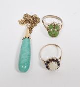 Gold-coloured metal, opal and sapphire oval cluster ring, a green stone set ring and a jade-type