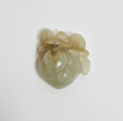 Chinese pale celadon and russet carved jade peach, Qing Dynasty, the fruit suspended from pierced