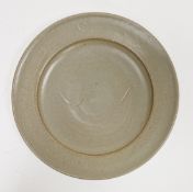 Ray Finch (1914-2012) for Winchcombe Pottery; a stoneware charger covered in celadon glaze with