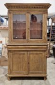 French style rustic glazed cabinet, the moulded cornice with dentil frieze, over two glazed doors
