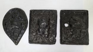 Three lead plaques, one pear-shaped with relief decoration of four horseshoes, 20cm long and the