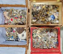 Three vintage sewing baskets filled with various costume jewellery, including earrings and pendants