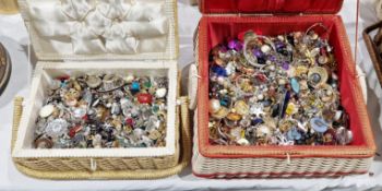 Two vintage wicker sewing baskets filled with costume jewellery earrings