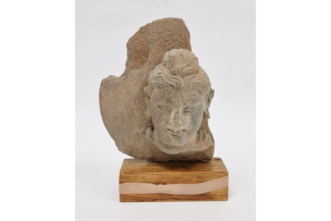 Carved stone Bodhisattva head fragment, possibly Gandhara region & 4th Century, the hair with - Image 1 of 11