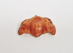 Gold-coloured metal carved coral brooch, possibly the head of Aries, 4cm wide