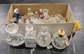 Collection of cut glass perfume bottles and stoppers, one with atomiser, a small collection of
