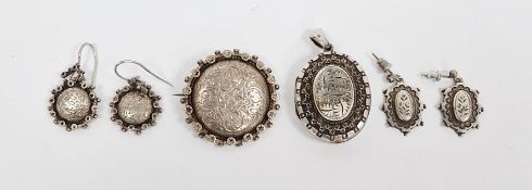 Silver-coloured metal brooch, circular, scroll engraved with star-pattern border and pair similar