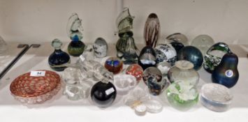 Collection of coloured glass paperweights including a Midsomer glass makers iridized model of a pear