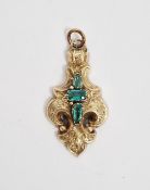 Antique gold-coloured metal and green stone pendant, fleur-de-lys shaped and engraved with three