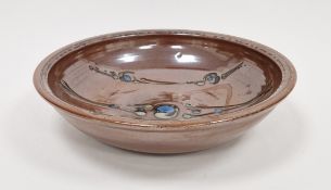 Ray Finch (1914-2012) for Winchcombe Pottery; a large stoneware bowl covered in iron rich glaze with
