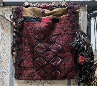Large red ground camel bag with central lozenge trelliswork, geometric borders, 72cm x 75cm approx