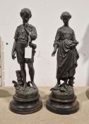 Pair of 19th century spelter figures of a young man and woman on wooden plinth bases, 38cm high