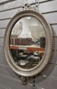 Modern wall mirror with a 19th-century style moulded silvered oval frame, 73cm high x 47cm wide