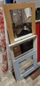 Three modern wall mirrors, the largest with oak frame measuring 135cm x 53cm