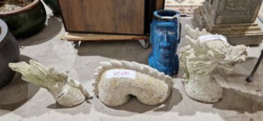 Reconstituted stone oriental dragon in three parts as if rising from the earth or sea, and a blue