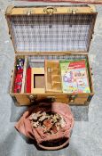 Wooden trunk with various toys, including a wooden jigsaw puzzle, plastic farm animals and