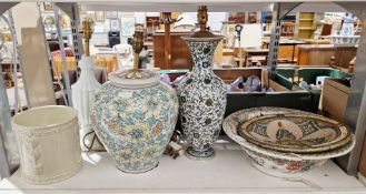 Two floral patterned ceramic table lamps, together with a white glazed table lamp, a cream glazed