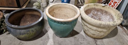 Three large garden planters, one dark brown glazed, another green and one of moulded concrete (3)