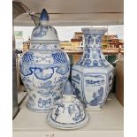 V Two modern Chinese ceramic jars with covers, both having blue and white decoration, the tallest