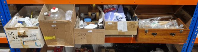 Large collection of scientific/laboratory items, including glass pipettes, test tubes, laboratory