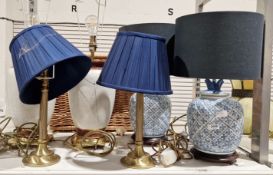 Three pairs of table lamps, including a blue and white ceramic pair in the form of ginger jars, a