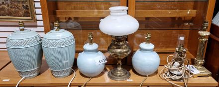 Two pairs of ceramic aqua blue table lamps, tallest 36cm high, two brass column table lamps and a