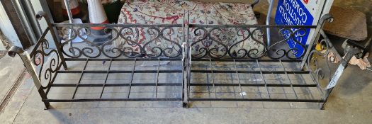 Pair of wrought iron hand forged log baskets of rectangular form, the back and side panels with S-