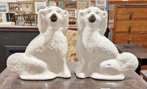 Pair of Staffordshire white glazed mantel dogs, 31cm high