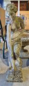 Composite stone garden statue of a scantily clad classical female figure, 94cm high