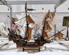 Wooden scale rigged model of the Golden Hind with stand and plaque, 80cm long x 63cm high