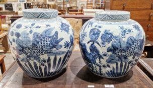 Pair of Chinese blue and white glazed ginger jars with lids, 28cm high