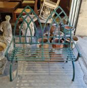 Garden metal bench in the Gothic manner, with a green finish having a double arched back and slatted