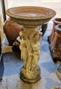 Composite stone birdbath of circular form, the pedestal in the form of the three Graces, 80cm high x