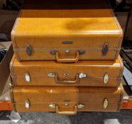 Set of three mid-20th century Samsonite tan/brown hardshell suitcases, largest 65cm wide