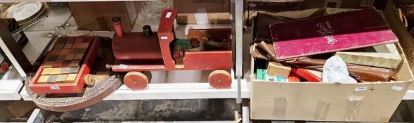 Collection of toys including a wooden child's pullalong train and trailer with wooden blocks,