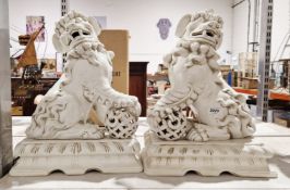 Pair of Chinese-style white glazed ceramic models of Dogs of Fo, 42cm high