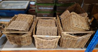 Collection of 11 wicker baskets, all of rectangular forms and four having wooden handles, largest