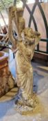 Composite stone garden statue of a classical female figure carrying an urn on her shoulders, 91cm