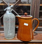 Mid-20th century wire bound glass soda syphon together with a large Denby stoneware brown and blue