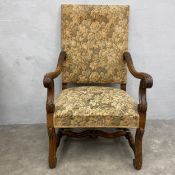 A 19th century French Provincial style carved walnut fauteuil armchair with tapestry upholstered