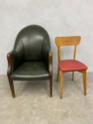 A Georgian style green leather library tub armchair with shaped back and arms raised on tapering