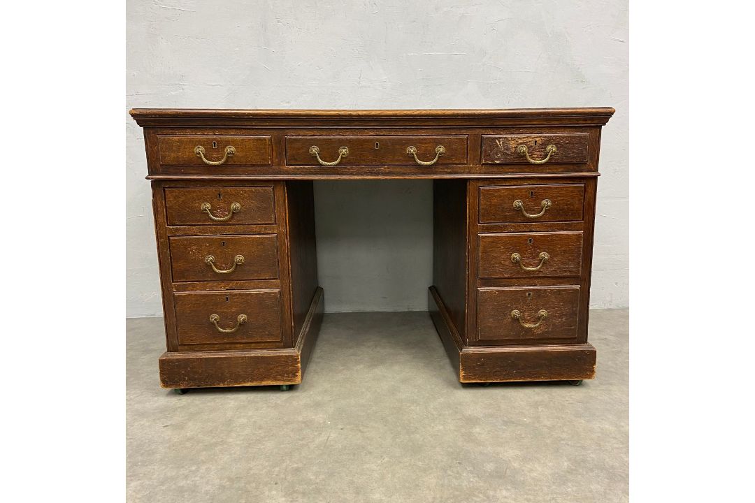 A C.1900 oak twin pedestal desk in three sections with blue leather lined top over an arrangement of - Image 1 of 6