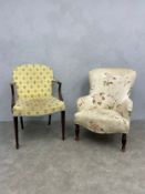 A Georgian mahogany framed armchair with needlework upholstered back and stuffover seat raised on