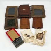 Six late 19th/early 20th century contact print frames together with a box of printed glass slides
